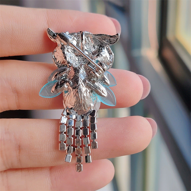 Elegant rhinestone owl brooch close-up