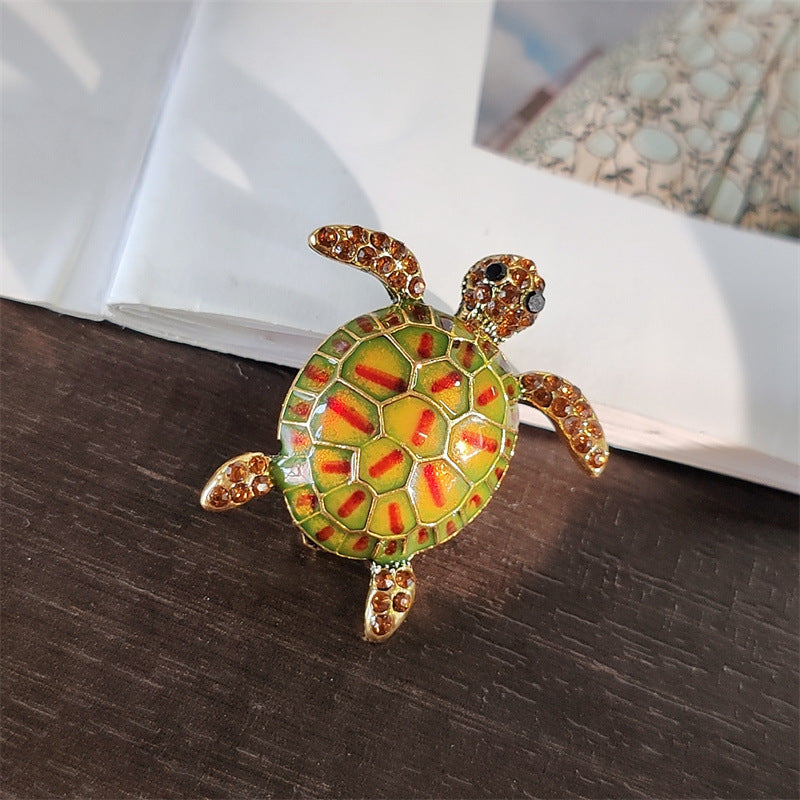 Colourful turtle pin brooch styled with outfits