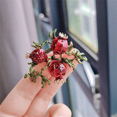 Vintage fruit-themed brooch with apple design