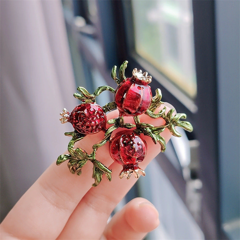 Retro fruit brooch featuring a cherry motif
