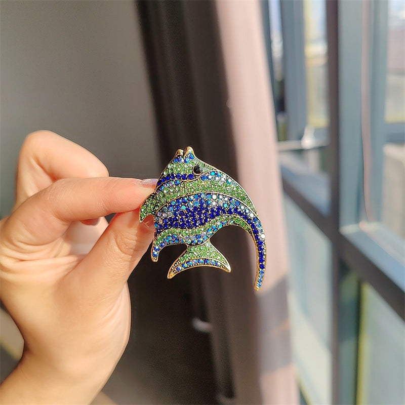 close-up of cute colourful fish brooch