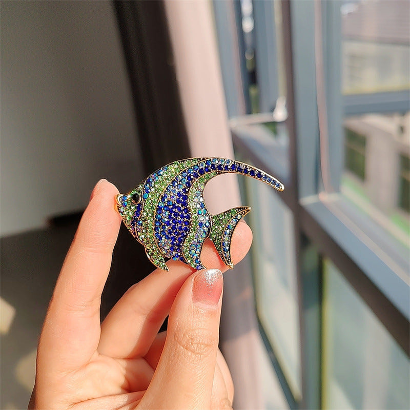 close-up of cute colourful fish brooch