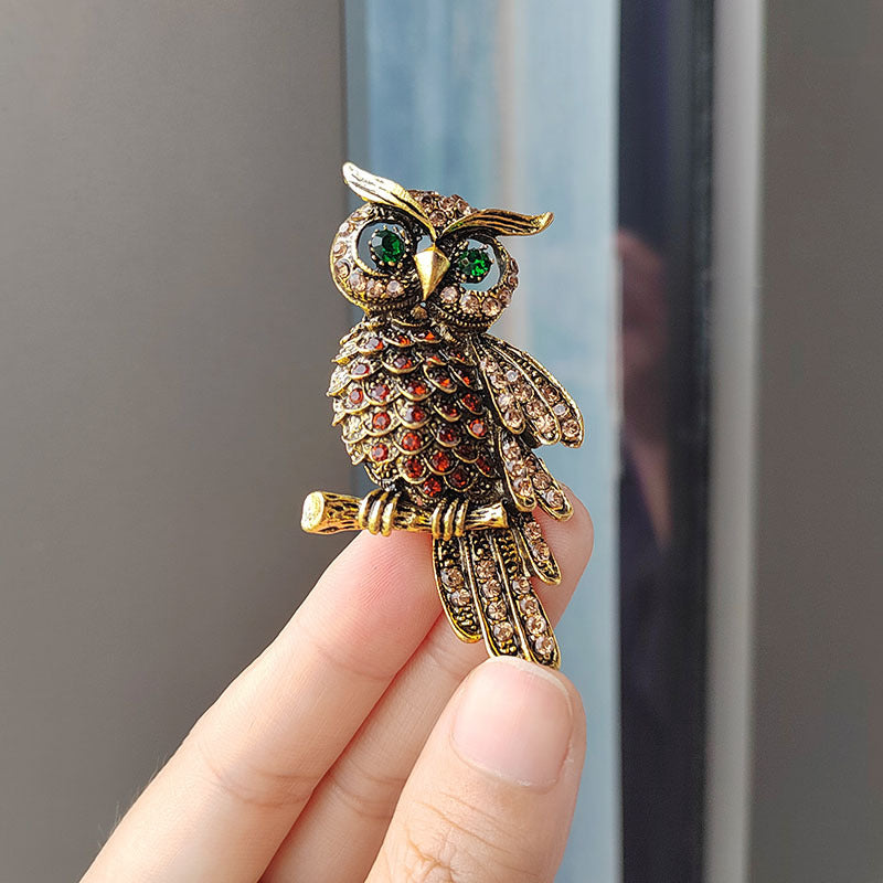Side view of luxury owl brooch pin with diamond embellishments
