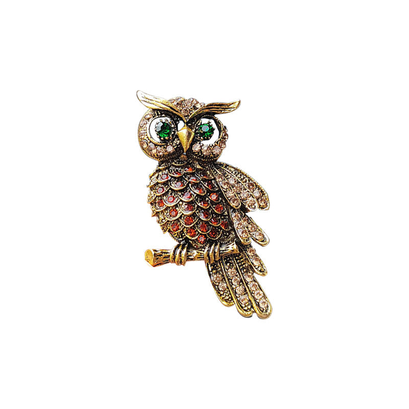 Elegant showcase of the owl brooch from multiple angles
