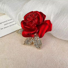 Elegant rose brooch displayed on a coat