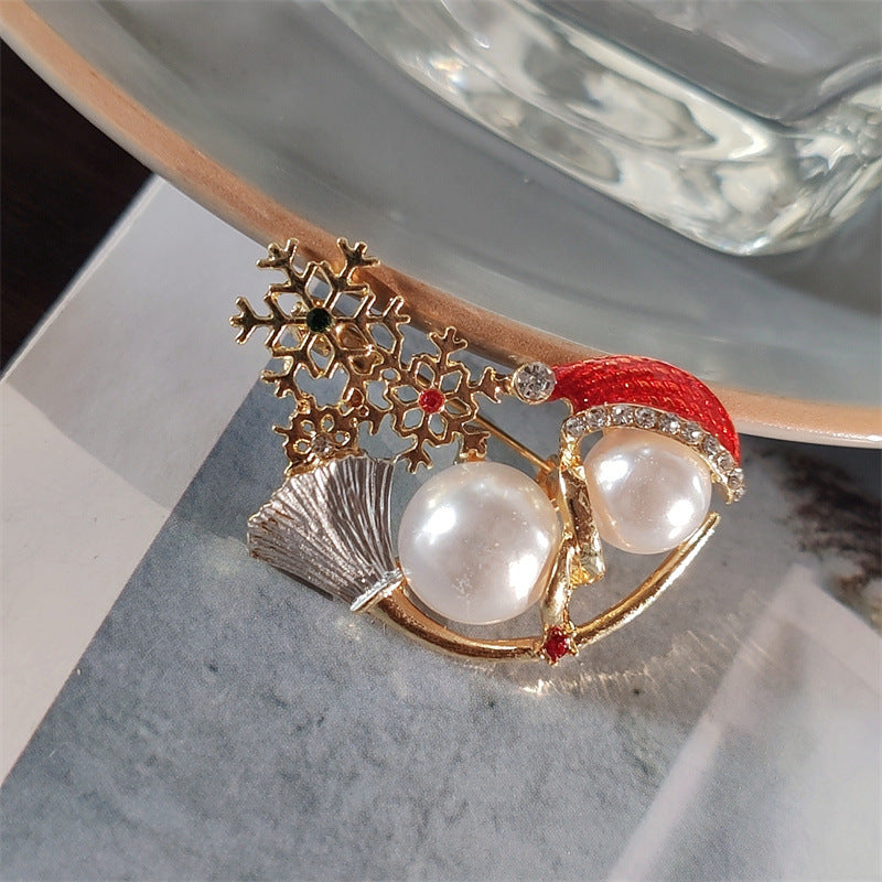Snowman brooch worn on a jacket