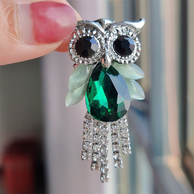 Blue owl brooch showcasing crystal detail