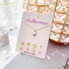 Playful moon and snowman themed earrings close-up