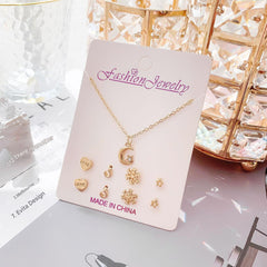 Gold-plated minimalistic necklace on a white display