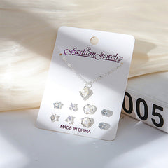 Gold-plated minimalistic necklace on a white display