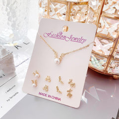 Beauty shot of gold jewelry set for women