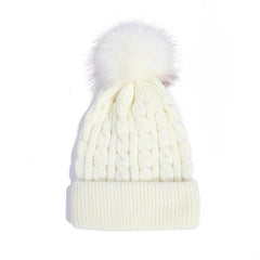 Pink knit beanie with pom pom details