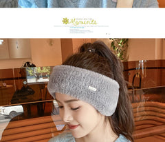 Cozy ear warmer beanie in snowy winter background