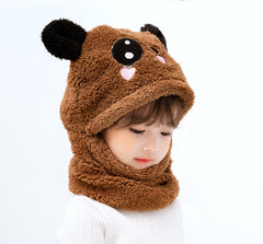 Little girl wearing colourful winter hat and scarf