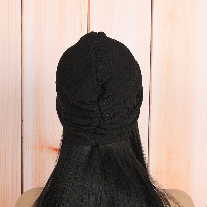 beige twist headwrap beanie showcasing stylish knot design