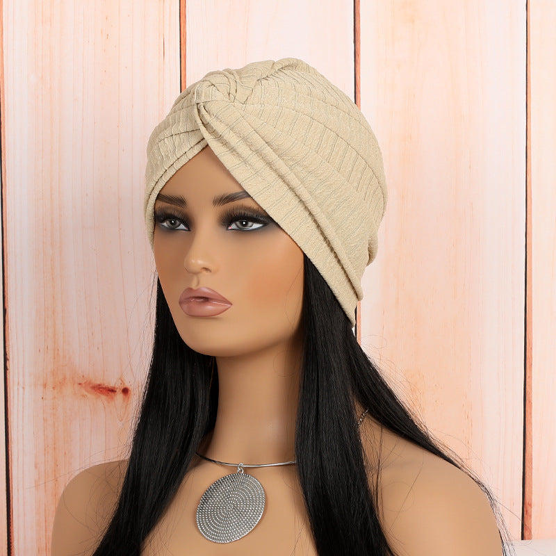 model wearing a fashionable twist headwrap beanie