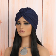beige twist headwrap beanie showcasing stylish knot design