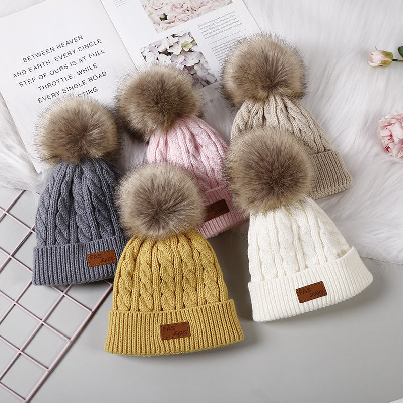 children wearing knitted beanie with pom-pom
