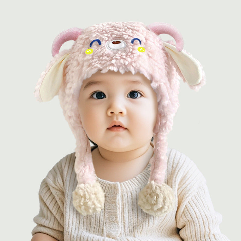 Toddler wearing a cute plush winter beanie
