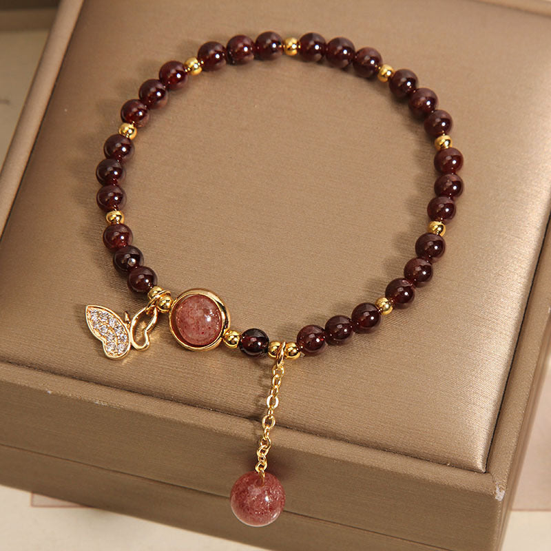 Close-up detail of garnet crystal charm