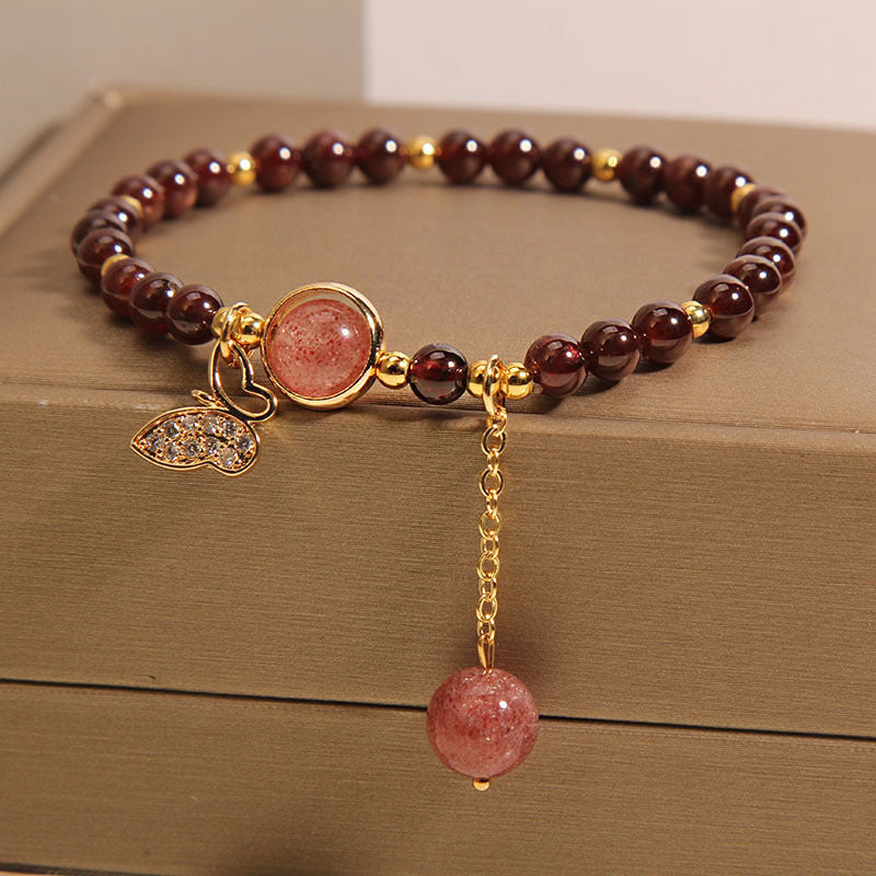 Close-up detail of garnet crystal charm