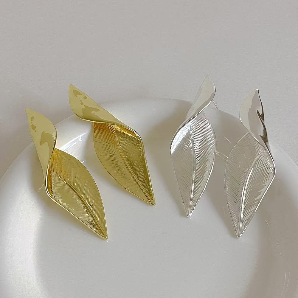 Vintage-inspired leaf earrings in gold finish