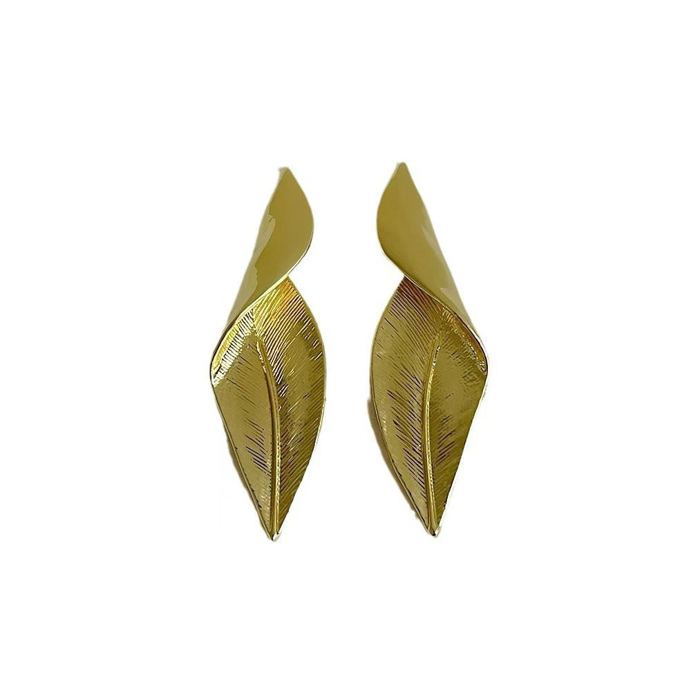 Side view of lightweight leaf earrings on display