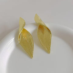 Unique vintage leaf earrings showcased in a box