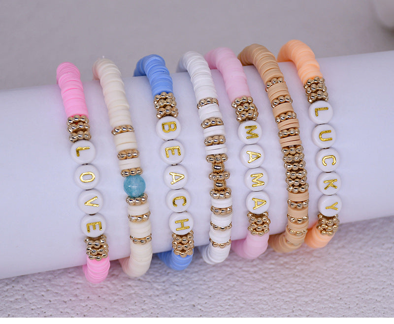 Elegant friendship bracelet stacked with other jewellery