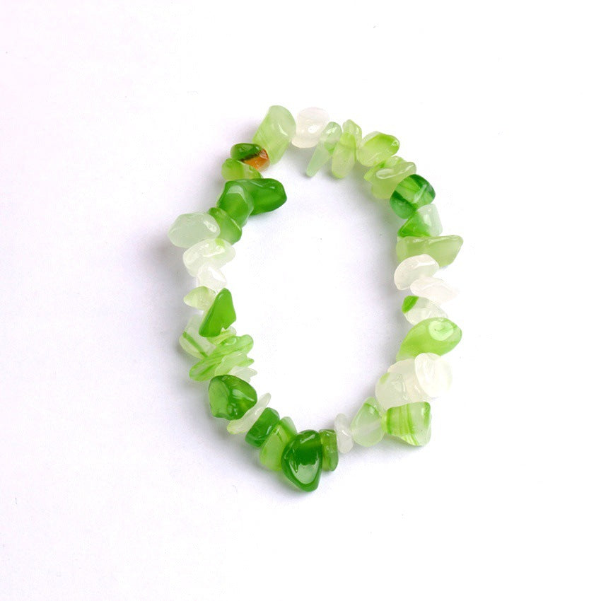 Close-up of colourful crystal charms on bracelet