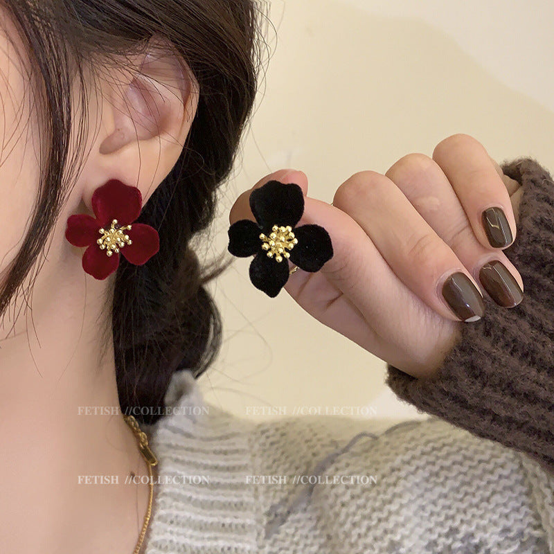 Close-up of premium velvet floral design earrings