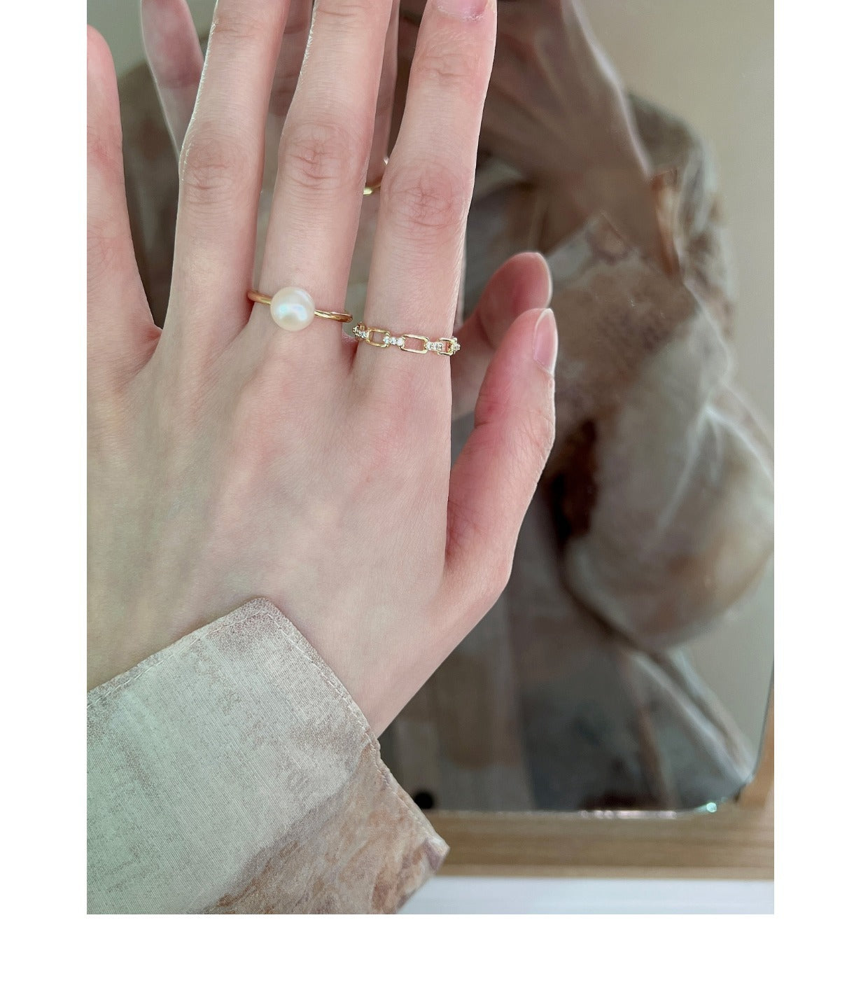 Butterfly ring with pearl accent on display