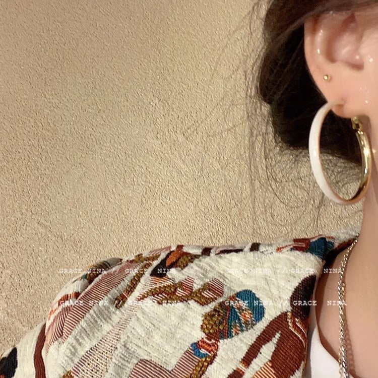 Close-up view of oversized circle earrings design