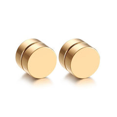 Close-up of magnetic ear studs on a white background