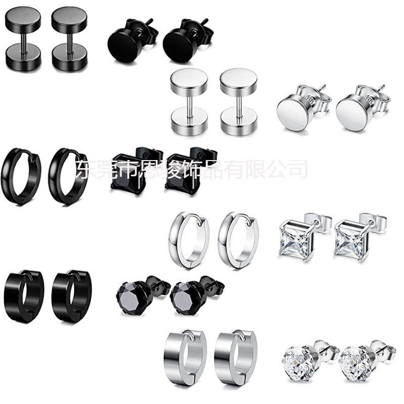 Close-up of stainless steel cross design earrings