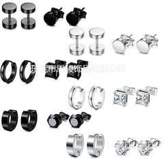 Close-up of stainless steel cross design earrings