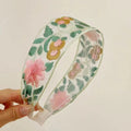 Comfortable fabric floral headband on display