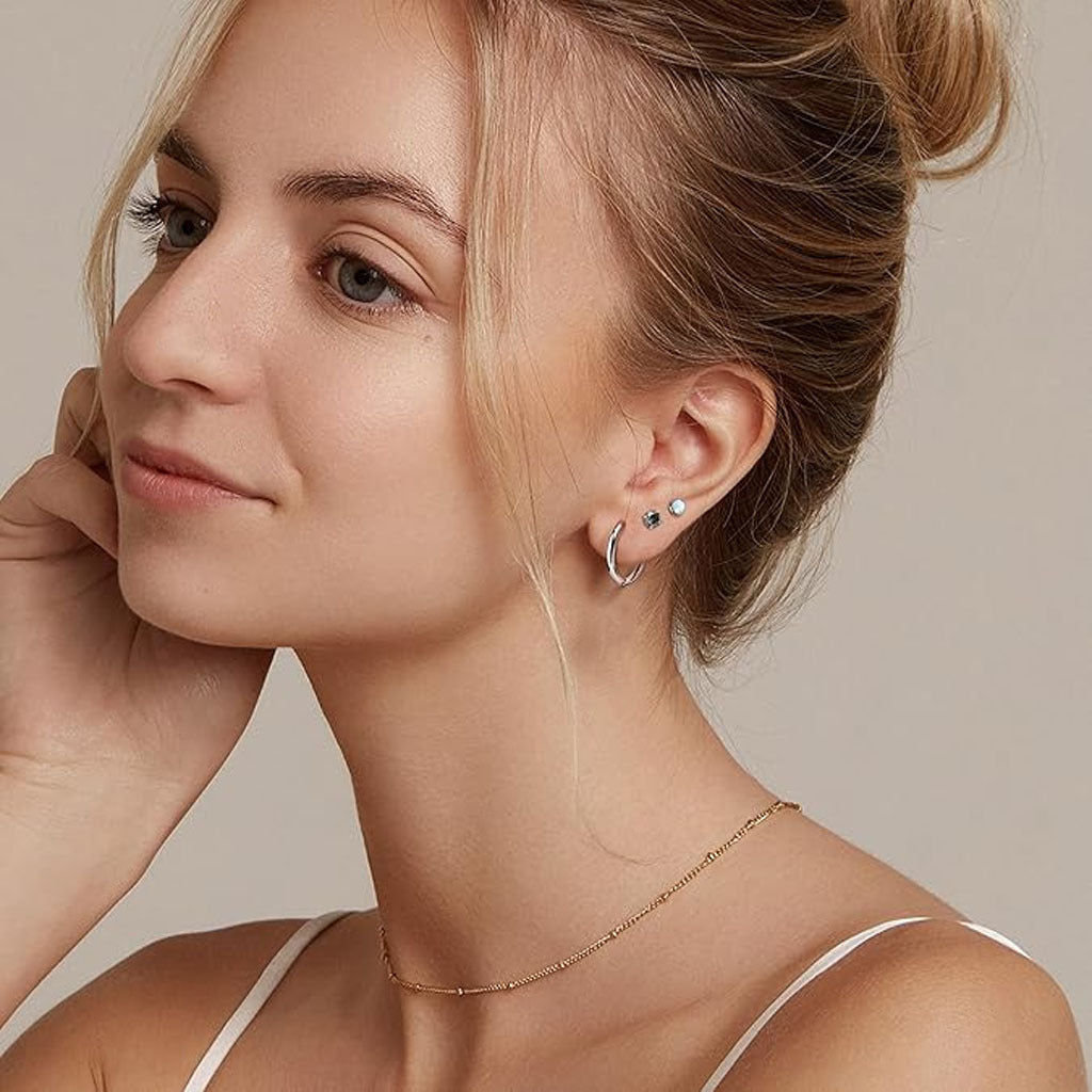 Close-up of stylish geometric zirconia earrings