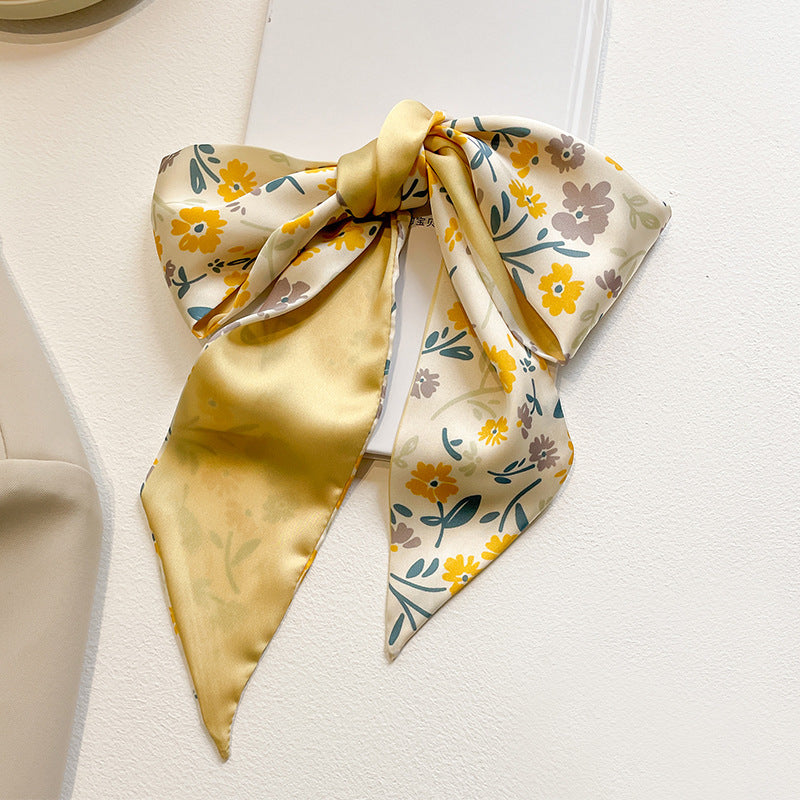 yellow scarf tied to bag