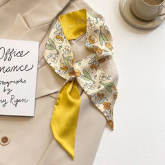 yellow floral scarf draped elegantly