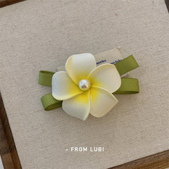 Detailed view of floral hair accessories