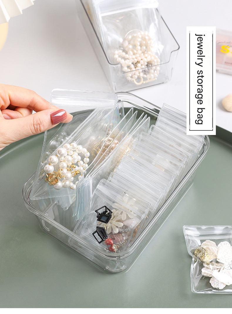 Compact travel jewellery organiser with compartments